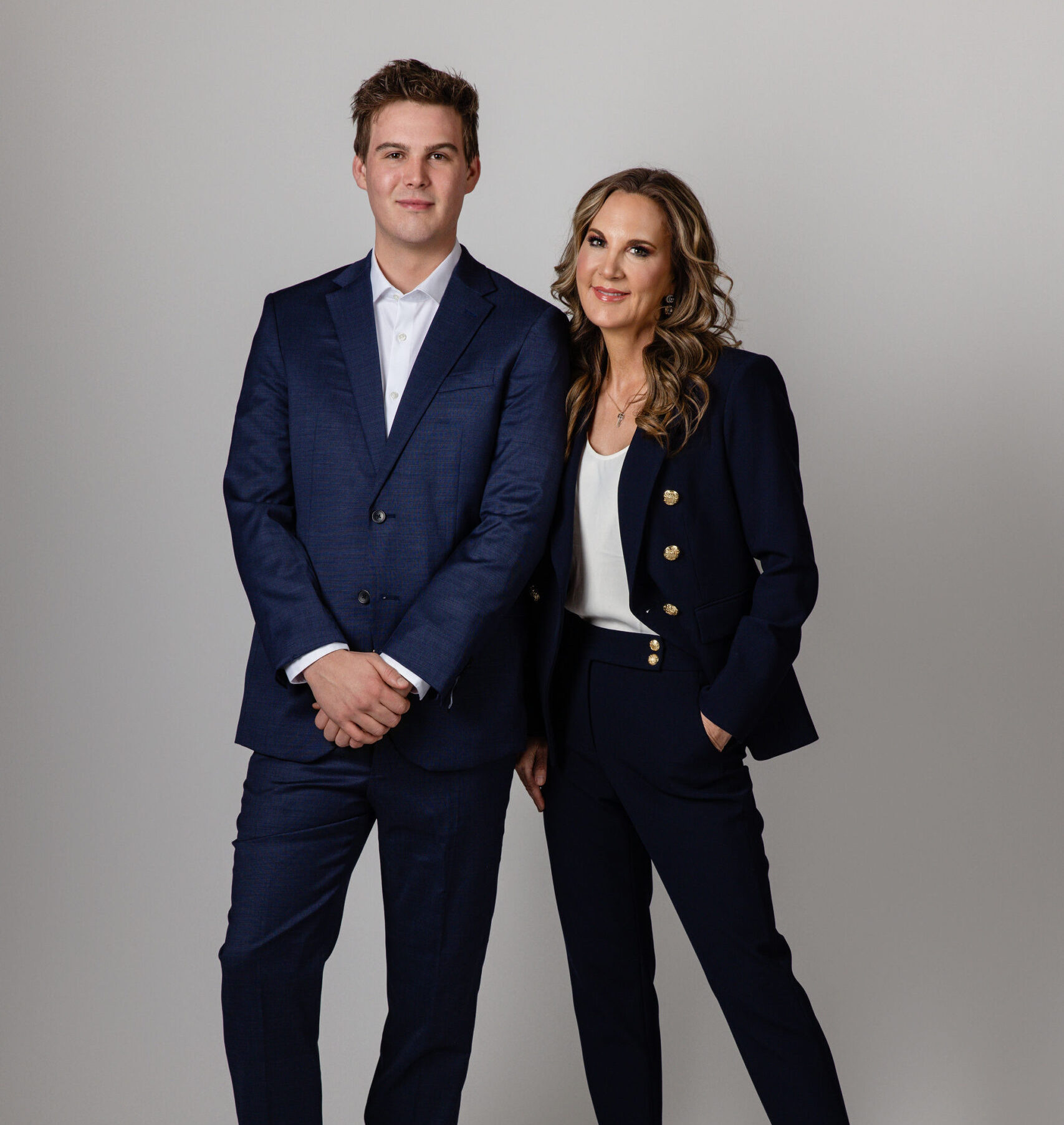 owner and marketing director smiling together